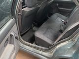 an image of a car with the door open sitting in a parking lot