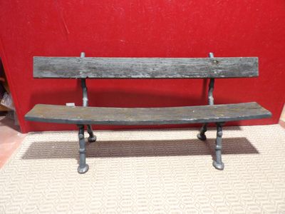 a wooden bench that is sitting on the floor