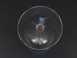 a close up of a wine glass on a table