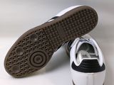 a close up of a pair of shoes on a white surface