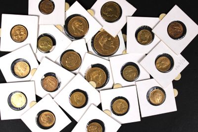 a pile of coins sitting on top of a black table
