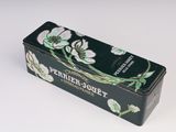 a black box with white flowers on it on a white surface