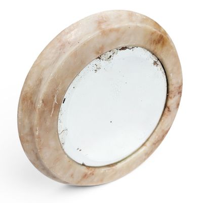 MIROIR rond à encadrement en marbre.