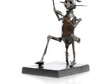 statue of a man holding a knife and a knife in his hand