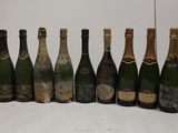 several bottles of champagne are lined up on a table