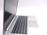 a close up of a laptop computer on a white surface