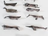 a lot of small figurines of animals on a white surface