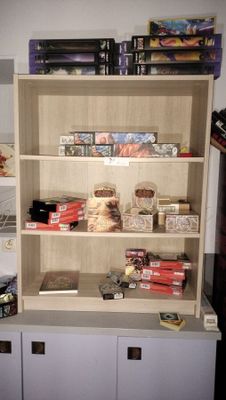 a book shelf with a lot of food on top of it