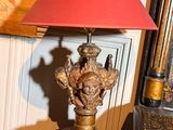 a lamp that is sitting on a table in a room