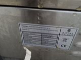 an image of a stainless steel refrigerator with a label on it