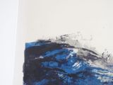 a picture of a blue and black painting on a white wall