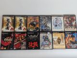 several video games are lined up on a white surface