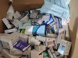 a cardboard box full of toiletries and other items