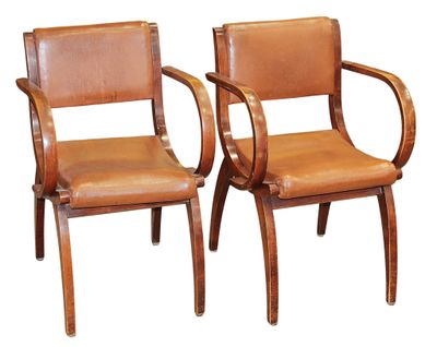 two brown leather chairs with wooden arms and arms