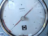 a close up of a gauge on a machine