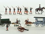 a lot of figurines that are on display on a shelf