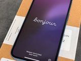 an iphone x is sitting on top of a box on a table