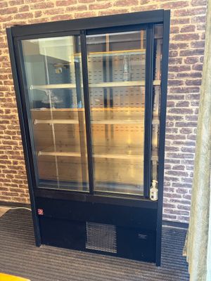 an image of a glass door with shelves in it