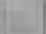 a close up of a white square frame on a white wall