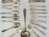 a lot of silver spoons and forks arranged in a circle