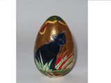 an image of a decorated easter egg with a black cat on it