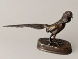statue of a pheasant on a base on a white background