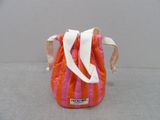 a small orange and pink bag with a white handle