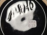 a close up of a black and white vase with the word gravy written on it