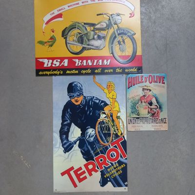 three posters of motorcycles are displayed on a wall in a room