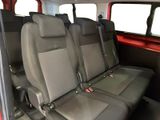 four seats in the back of a van that are empty