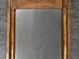 a mirror that is on the wall in the room