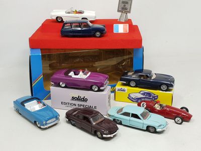 a box of assorted toy cars on a white surface