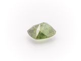a green tourmaline gems on a white background