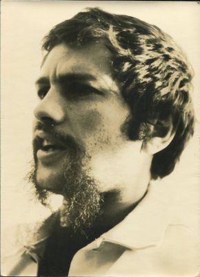black and white photograph of a man with a beard and a tie