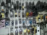 many different types of cell phones on display in a store