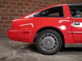 an image of a red car parked in a garage