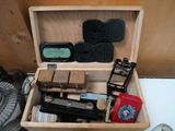 a wooden box filled with different types of tools