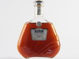an image of a bottle of brandy sitting on top of a table