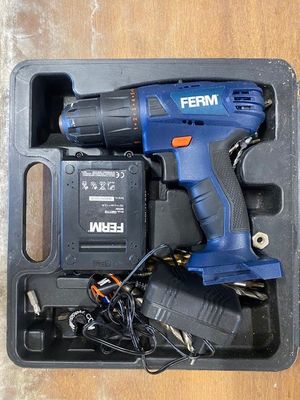 a cordless drill in a plastic case with a charger