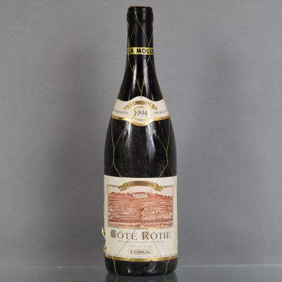 a bottle of wine on a glass table