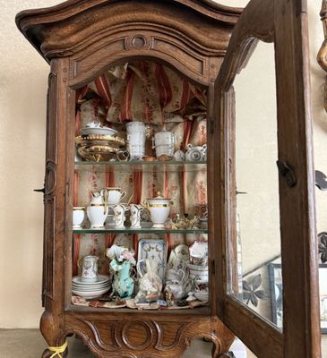a display case with a lot of china on it