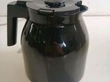 an image of a black coffee pot on a counter