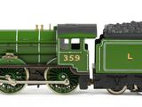a toy train that is sitting on a white surface