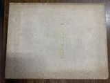 an old book sitting on top of a wooden table