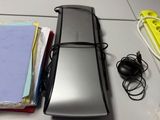 an image of a desk with a cell phone and other office supplies