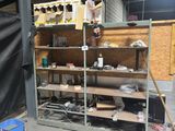 a room that has a shelf with a lot of items on it