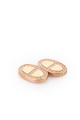 a pair of gold and diamond earrings