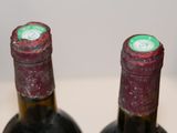 two bottles of wine that are sitting on a table