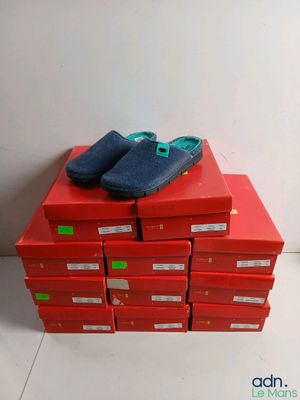 a stack of red boxes with blue shoes on them