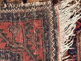 an image of a close up of a rug with a red and blue design